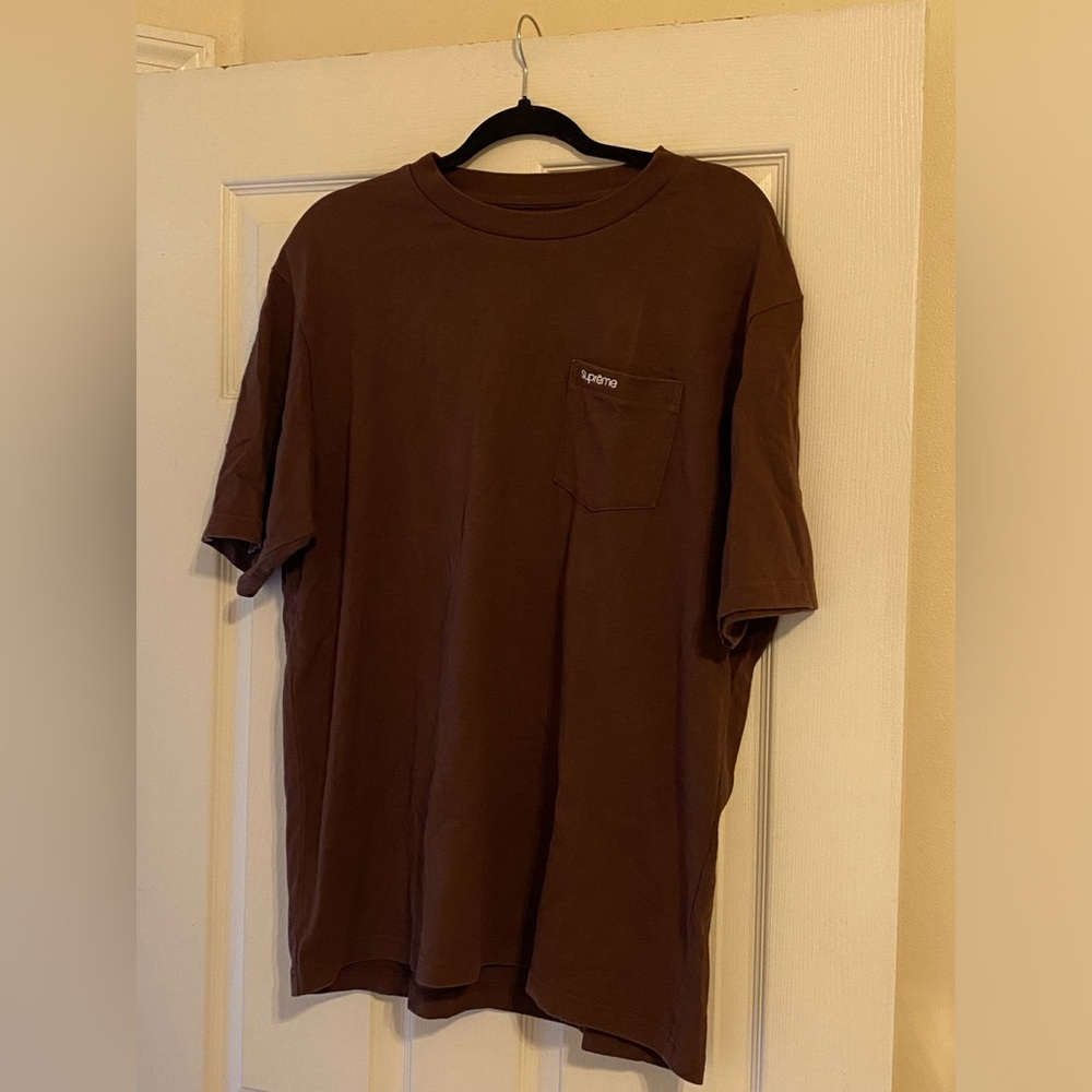 Supreme T shirt with original bag.